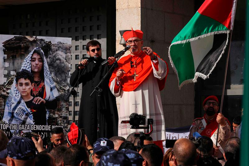 Latin Patriarch of Jerusalem Pierbattista Pizzaballa delivers a speech in Bethlehem town in the Israel-occupied West Bank on December 24, 2024, where he is slated to lead the annual Christmas eve procession at the Church of the Nativity. (Photo by HAZEM BADER / AFP)