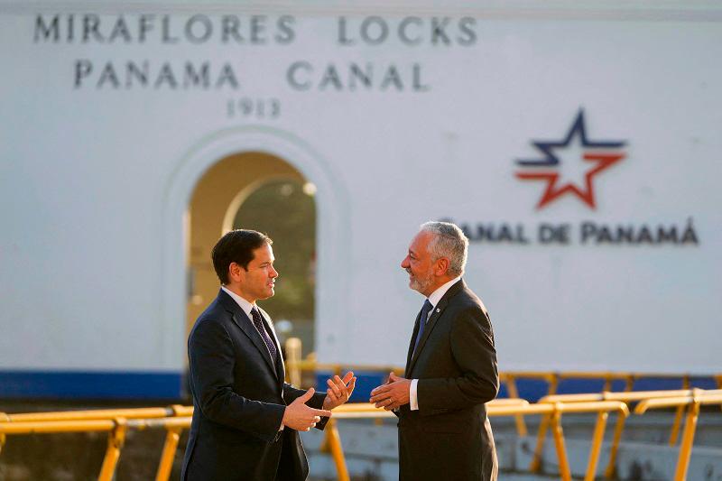 U.S. Secretary of State Marco Rubio (L) talks to Panama Canal Authority Administrator Ricaurte Vasquez during a tour at the Miraflores locks of the Panama Canal in Panama City on February 2, 2025. Rubio arrived on the eve on his debut trip abroad as US secretary of state, as he looks for how to follow up on President Donald Trump's extraordinary threat to seize the Panama Canal. - Mark Schiefelbein / POOL / AFP