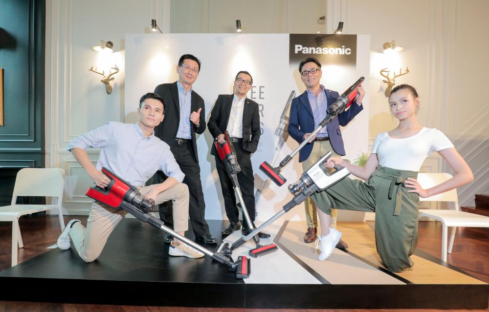 From left: Ng, Cheng and deputy managing director Hiroyuki Muto posing with the new cordless stick vacuum cleaners and the couple from the commercial. SUNPIX BY ASYRAF RASID