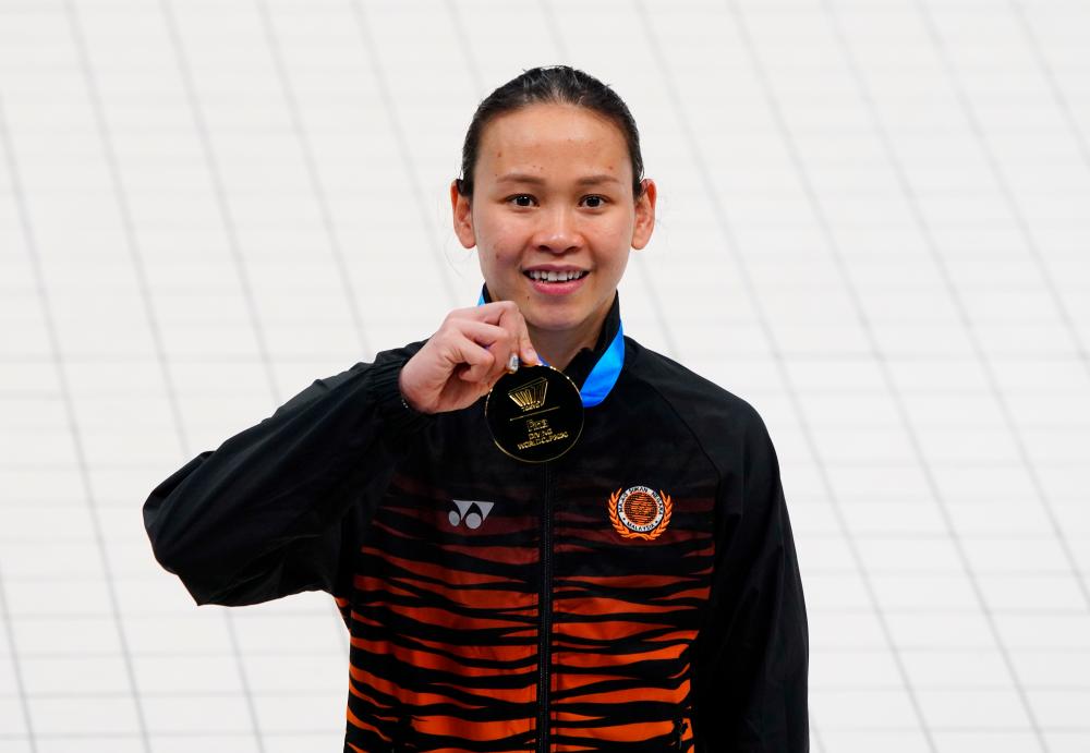 Gold medallist, Malaysia's Pandelela Pamg poses with her medal after winning the women's 10m platform final. — Reuters