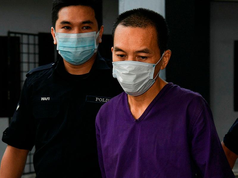 Pang Kar Foong (right), charged today for murder.-Bernama