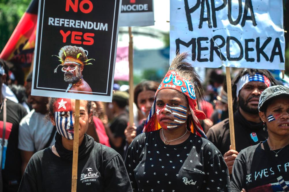 Papuan activists attend a protest in Surabaya December 1, 2020, to mark the Free Papua Organisation anniversary. — AFP