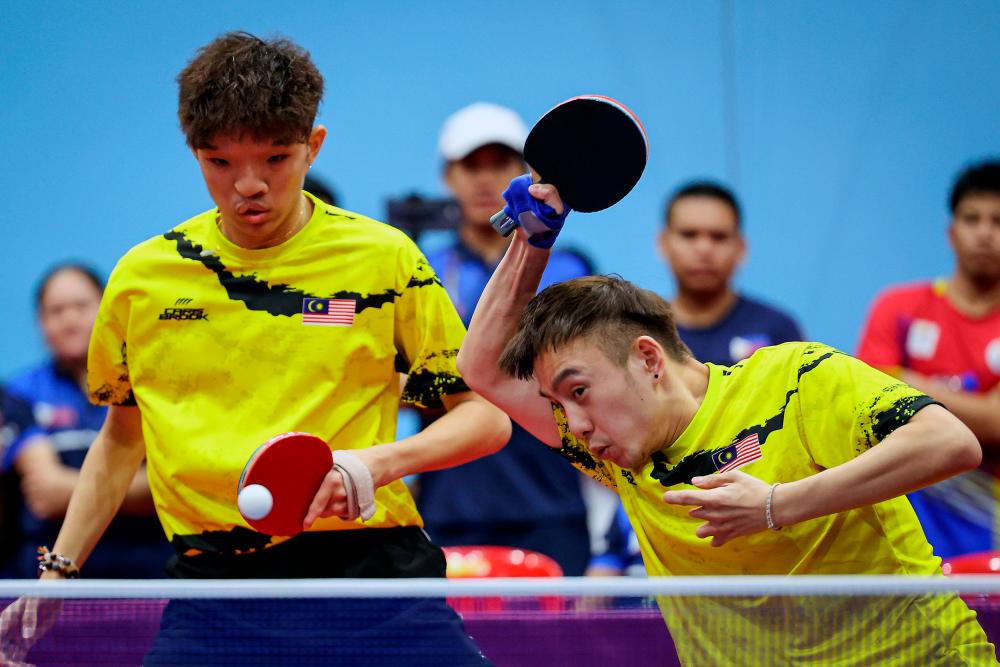 PHNOM PENH, June 6 -- The Malaysian contingent successfully achieved its target of 33 Gold medals through the Chee Chaoming-Brady Chin pairing in the Men’s Ping Pong Class 9 doubles event at the Table Tennis Hall, Morodok Techo Stadium, last night. BERNAMAPIX