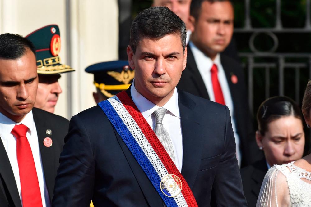 Paraguay's new President Santiago Peña attends a military and police parade in honor of the presidents present at the inauguration of Paraguay's new president Santiago Peña and the 486th anniversary of the founding of the city of Asuncion, next to the presidential residence in Asuncion, on August 15, 2023. - AFPPIX