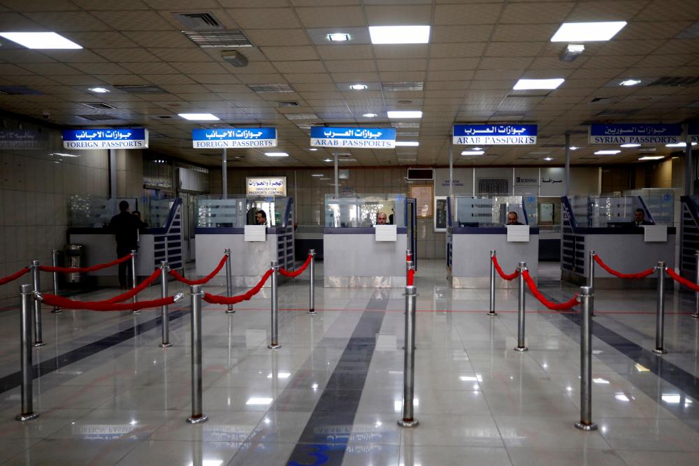 Passport control counters are pictured inside Aleppo international airport that has been reopened for the first time in years, Syria February 19, 2020. - Reuters