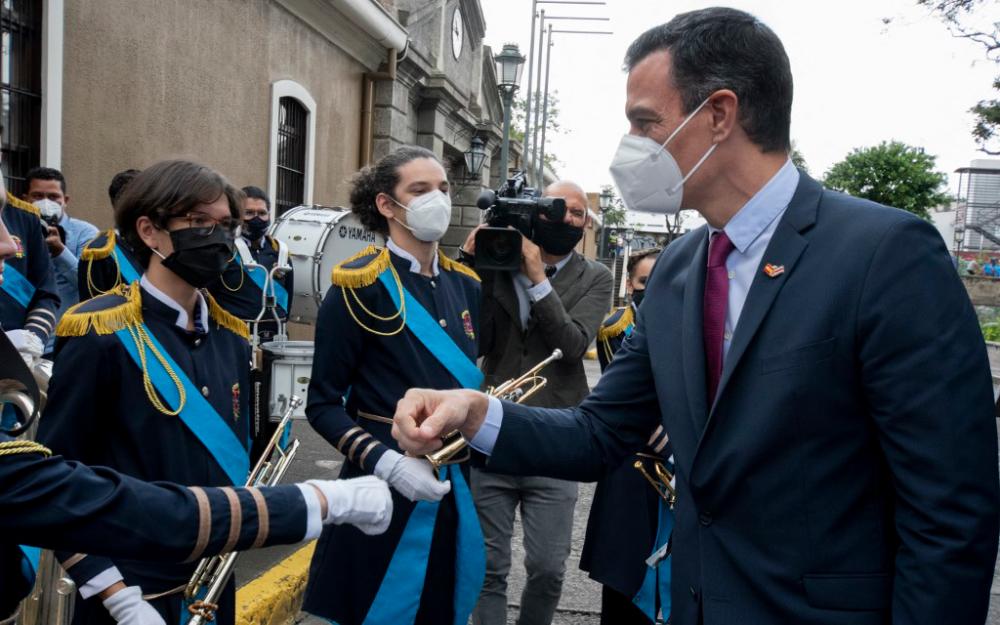 Prime Minister of Spain Pedro Sanchez (right) greets members of San Jose Municipal Band at Espana Park in San Jose, on June 11, 2021. — AFP