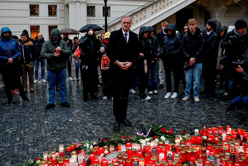 Czech Prime Minister Petr Fiala pays respects at a memorial during a vigil following a shooting at one of Charles University’s buildings in Prague, Czech Republic.–Reuterspix