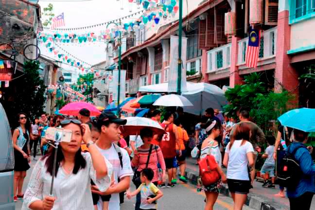 Tourists visit Armenian Street in George Town. – BERNAMAPIX