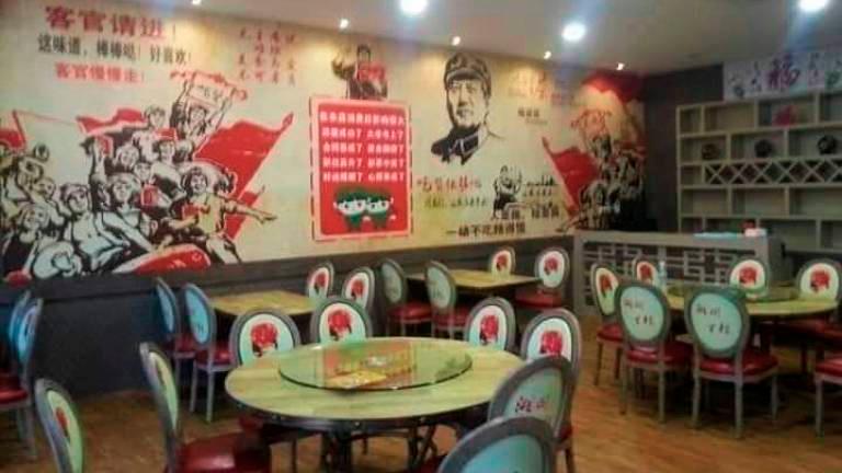 Owner of Communism themed cafes gives statement to police