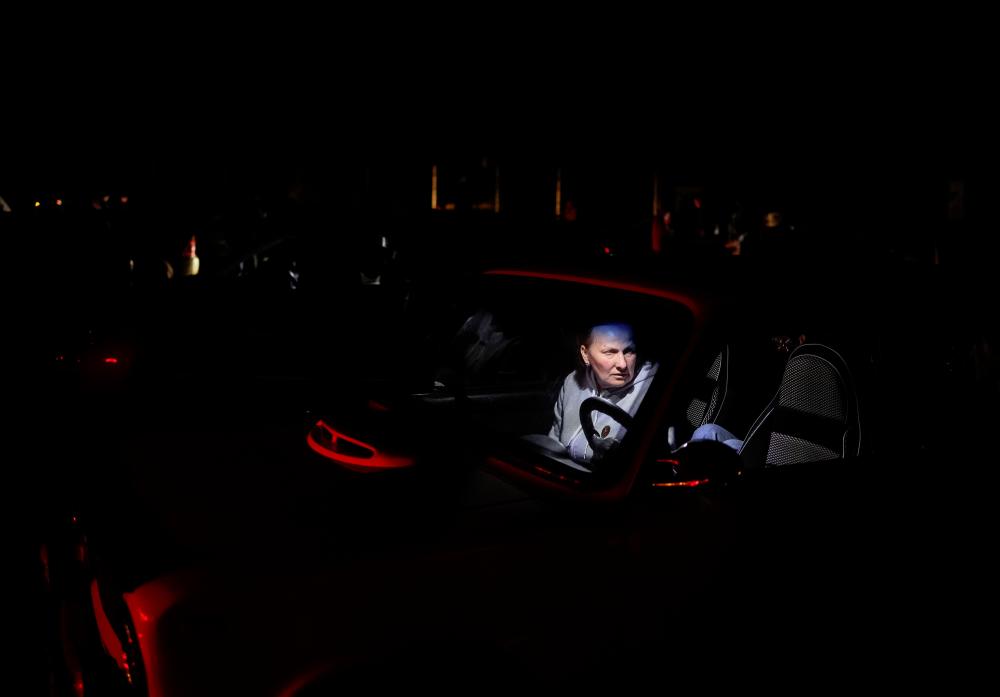 A Ukrainian refugee woman from Mariupol sits inside a car as she arrives at a registration and humanitarian aid centre for internally displaced people, amid Russia’s ongoing invasion of Ukraine, in Zaporizhzhia, Ukraine. - REUTERSpix