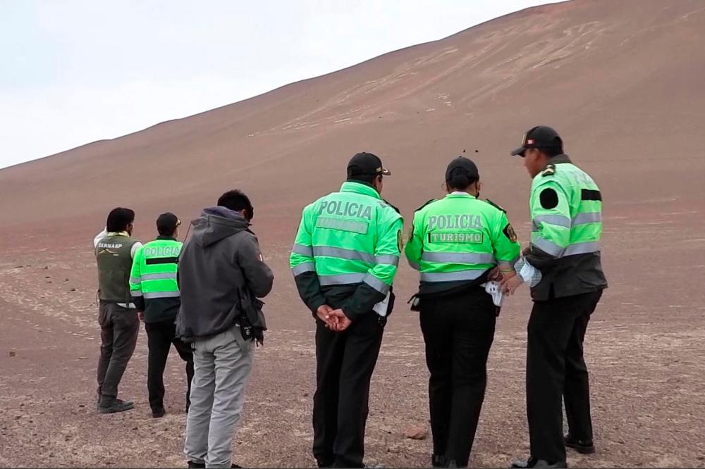 The famous Paracas Candelabra, a geoglyph of about 2,500 years old on a hill facing the sea in southern Peru, was damaged by intruders who walked on it this weekend, the Ministry of Culture reported. AFPPIX