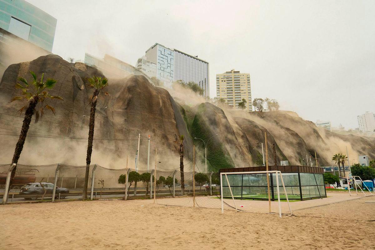 Dust billows out of a landslide during an earthquake in Lima on June 15, 2025. A magnitude 6.1 earthquake that shook Lima and its surrounding areas caused one death in Peru’s capital and several landslides. AFPpix