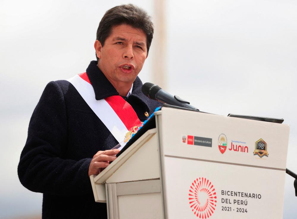Handout picture released by Peruvian news agency Andina showing President Pedro Castillo delivering a speech during a ceremony to commemorate the 198th anniversary of the Battle of Junin, in Junin, in the Peruvian Andes, on August 6, 2022. - AFPPIX