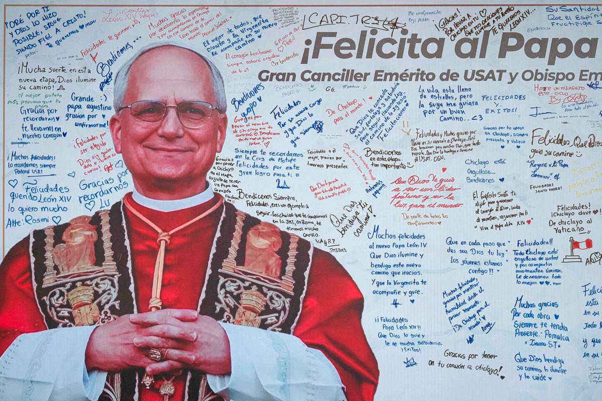 Messages are written on a banner with an image of Pope Leo XIV at the Santo Toribio de Mogrovejo Catholic University in Chiclayo, Lambayeque region, northern Peru, on May 12, 2025. – AFPpix