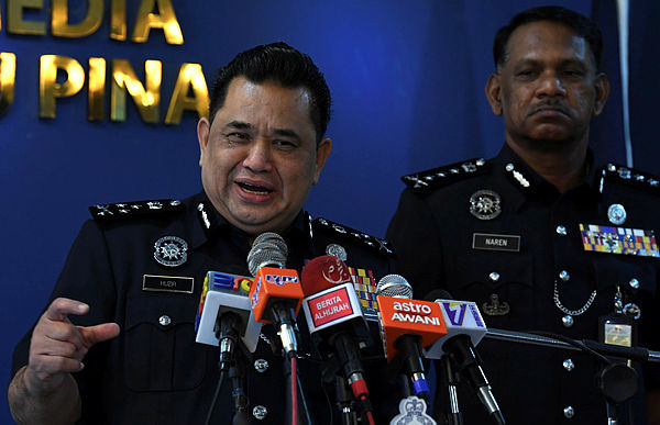 Bukit Aman Criminal Investigation Department director Datuk Huzir Mohamed (L) at a press conference at the Penang police headquarters, George Town on June 9, 2019. - Bernama