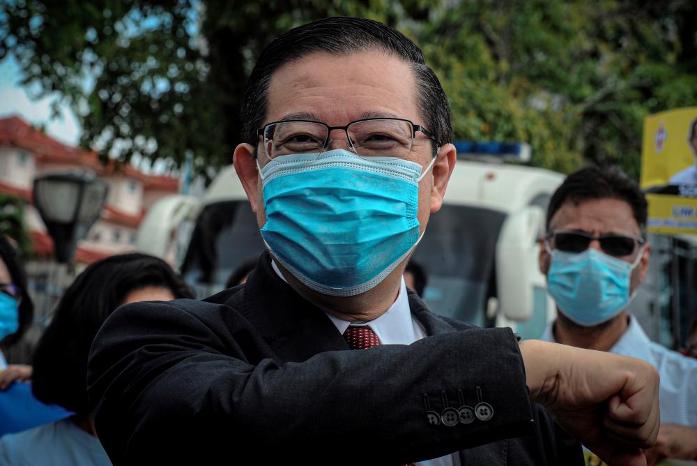 Former finance minister Lim Guan Eng was charged in the Sessions Court today with two counts of causing two plots of land belonging to the Penang government worth RM208.8 million to be disposed of to developers. — Bernama