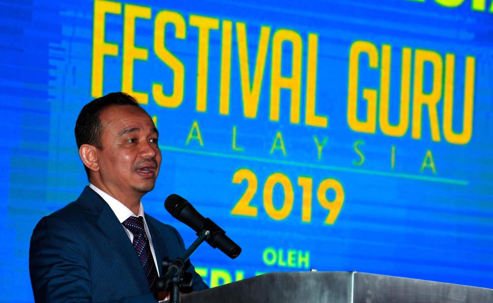Education Minister Dr Maszlee Malik speaks at the Teacher’s Day Appreciation ceremony in conjunction with the Teacher’s Festival at the Setia Spice Convention Center today. - Bernama