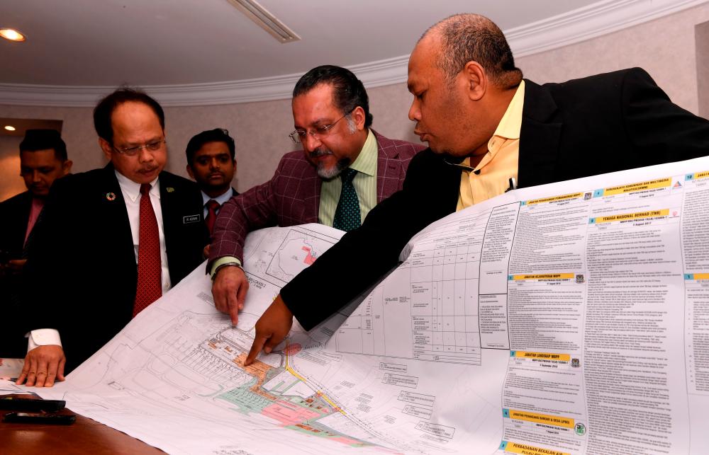 Penang Housing, Local Government, Town and Country Planning Committee chairman Jagdeep Singh Deo (2nd R) and project consultant Datuk Abu Hassan Salleh (R), at a press conference to unveil plans for the expansion of the Penang International Airport (PIA), on Dec 13, 2019. — Bernama