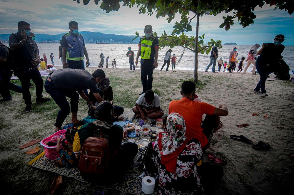 Seberang Perai Utara District Police chief ACP Noorzainy Mohd Noor (middle) with his team during the operation at Bagan Ajam Rest and Recuperation centre yesterday.-Bernama