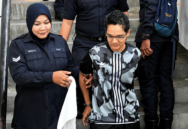 Nur Zahariah Yusoff, 32, (R) along with Zawani Zulkifli, 33, were arraigned in the Penang High Court today on charges of distributing drugs three years ago. — Bernama