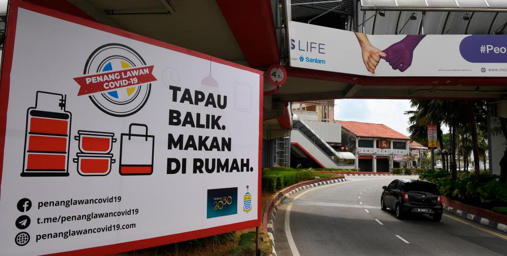 Various signs were erected by the Penang state government to prevent the spread of the Covid-19 outbreak. - Bernama