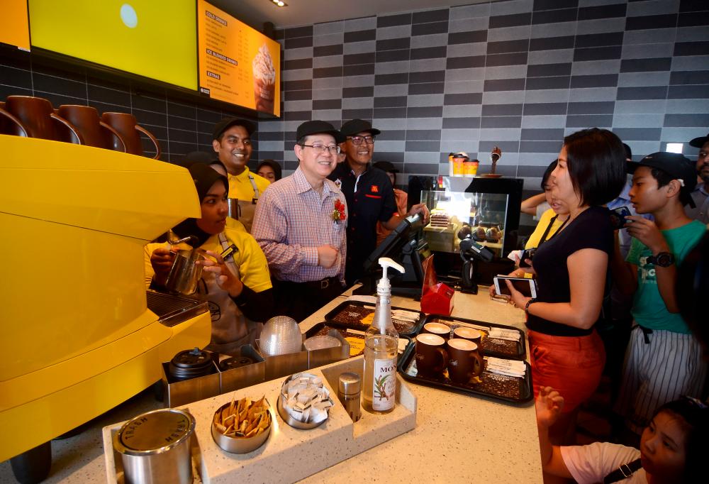 Finance Minister Lim Guan Eng meets members of the public during the opening of McDonald’s Bagan Ajam outlet today. - Bernama