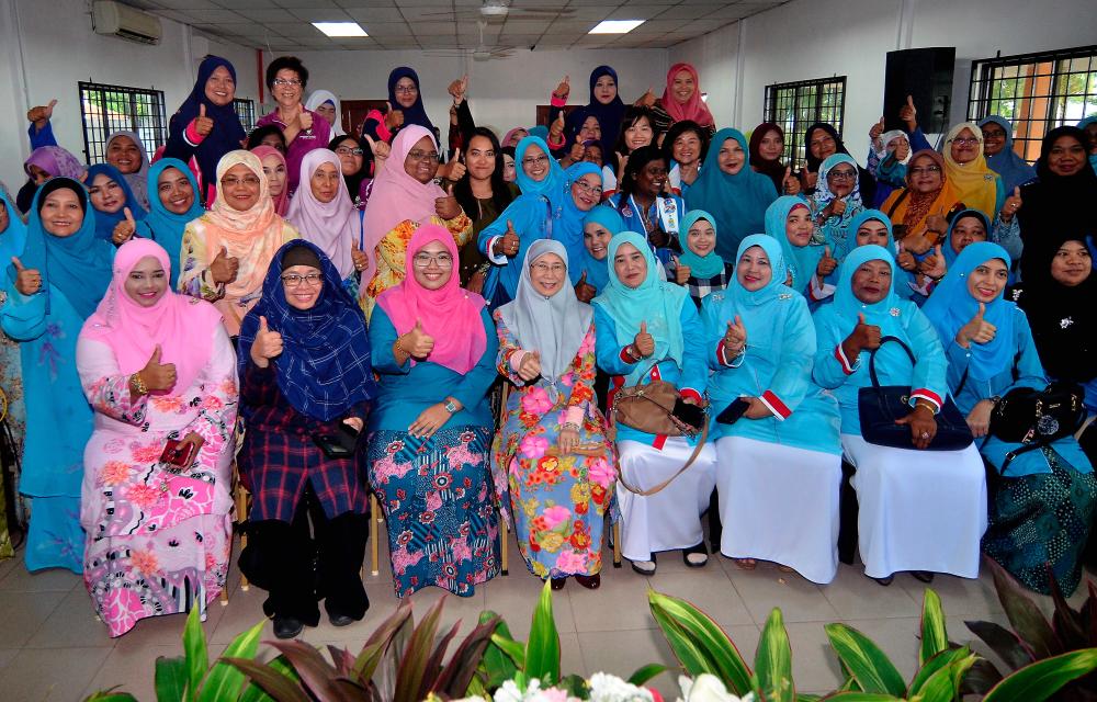 Deputy Prime Minister Datuk Seri Dr Wan Azizah Wan Ismail (seated, middle) pictured at a tea reception with the Penang PKR women’s wing at Pantai Robina. - Bernama