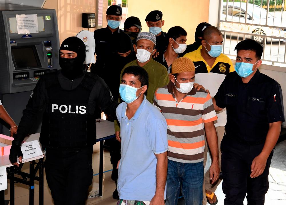 The 16 accused are led to the session court in Penang, on July 2, 2020. — Bernama