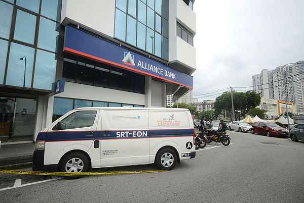 Two men run away with RM230,000 after robbing a security van at a bank in Jalan Tun Dr Awang at noon today. — Bernama