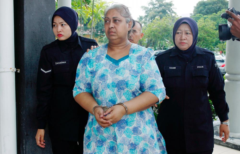 Ambika M. A. Shan, 60, being led to the Bukit Mertajam Magistrate’s Court in Penang on Feb 21, 2018. — BBX
