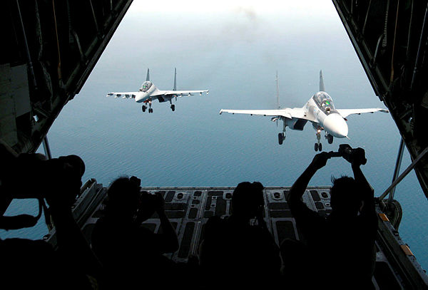 Two RMAF Su-30MKM fighter jets are being photographed from the exit ramp of a RMAF C130 transport plane, while flying over Penang on March 21, 2019. — BBXpress