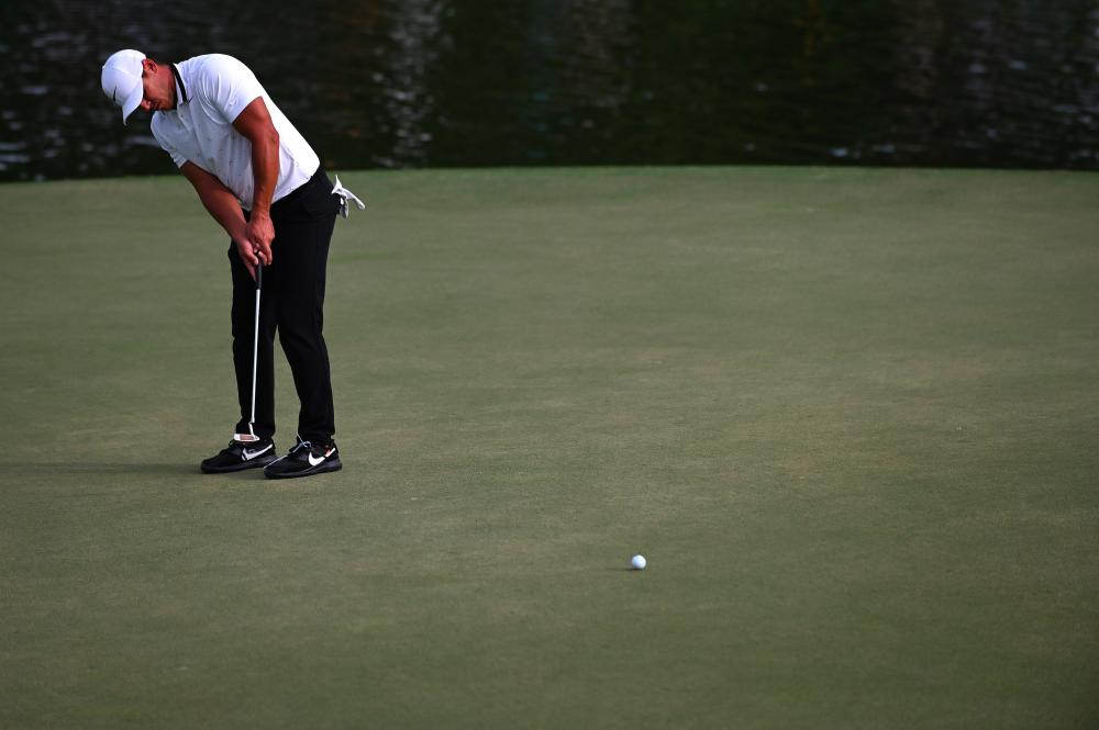 Brooks Koepka putts on the 15th hole during the second round of the Tour Championship golf tournament at East Lake Golf Club. - AFP