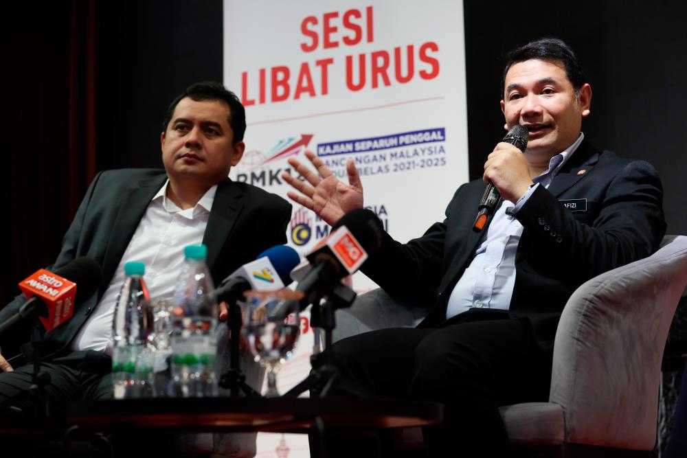 KUANTAN, May 16 -- Economy Minister Rafizi Ramli (right) spoke during a press conference at the Management Engagement Session (SKU) of the Half Term Review (KSP) of the 12th Malaysia Plan 2021-2025 with the Pahang State Government, today. BERNAMAPIX