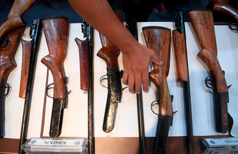 Seized home-made shotguns at a press conference at Bentong Police headquarters on April 3, 2019. — Bernama