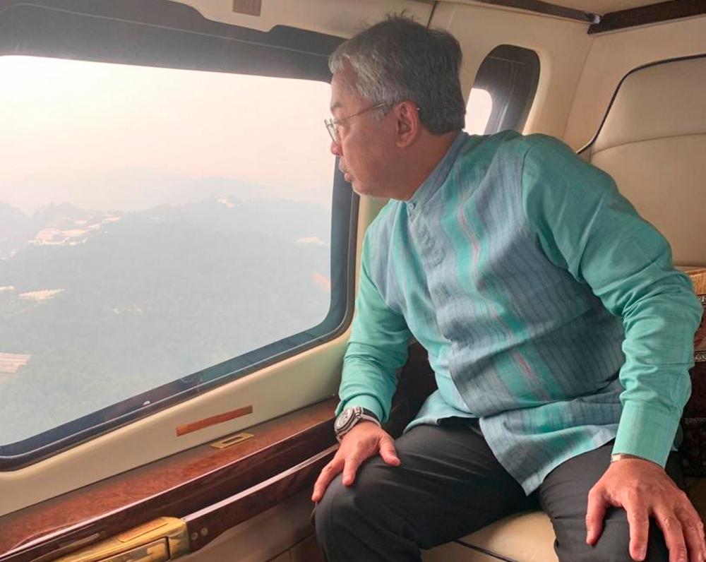 The Yang di-Pertuan Agong Al-Sultan Abdullah Ri'ayatuddin Al-Mustafa Billah Shah gets a birds eye view of Cameron Highlands, aboard a helicopter, on Sept 8, 2019. — Bernama