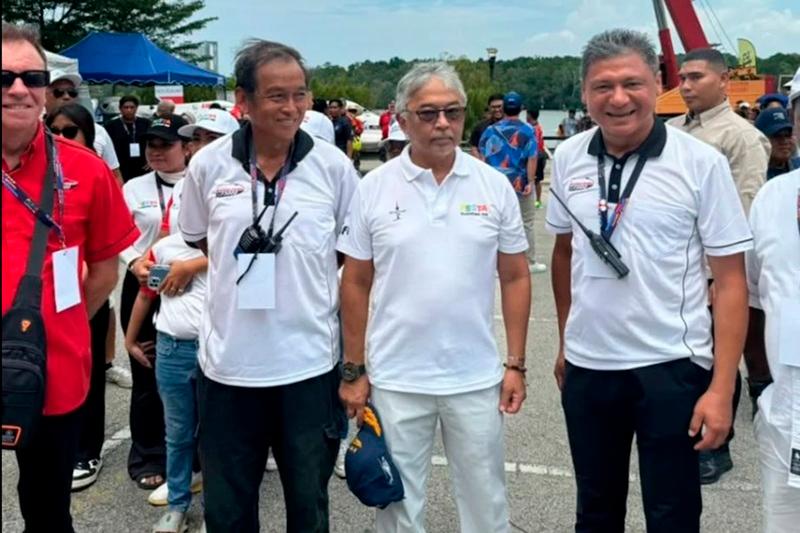 Pahang ruler Al-Sultan Abdullah Ri’ayatuddin with Theseira (right) before the start of the Royal Pahang F3000 Championship. - Pix credit: Platinum Charters Sdn Bhd