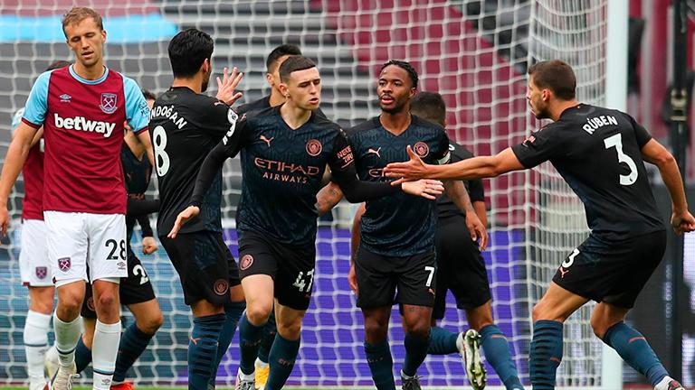 Manchester City’s Phil Foden (centre) celebrates scoring their first goal with teammates during their English Premier League match against West Ham United at London Stadium. – REUTERSPIX
