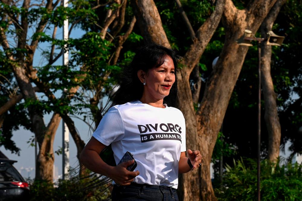 This photo taken on February 14, 2023 shows Stella Sibonga (L), a pro-divorce advocate, taking part in a demonstration on Valentine’s Day in front of the Senate Building in Pasay, Metro Manila/AFPPix