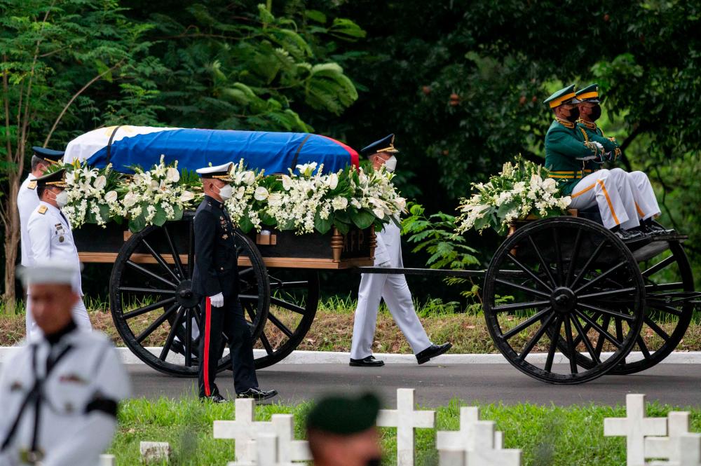 Soldiers transport the casket carrying the urn of former Philippine president Fidel Ramos during the state funeral at the Heroes Cemetery in Taguig, metro Manila August 9, 2022. - AFPPIX
