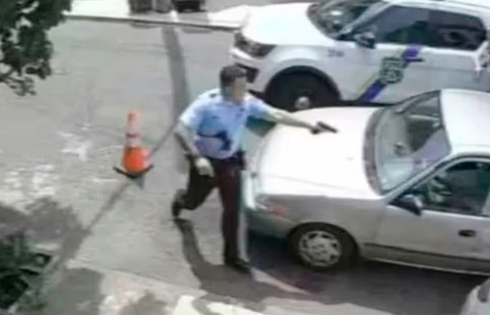 Philadelphia police officer Mark Dial approaches the vehicle of Eddie Irizarry in surveillance footage released by Shaka Johnson, the lawyer representing Irizarry’s family. REUTERSPIX