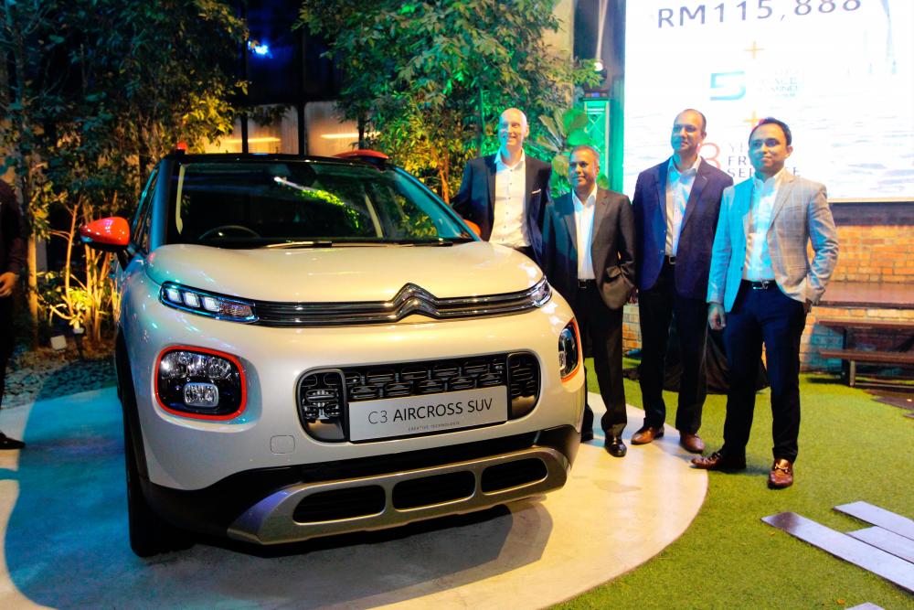 $!From left to right: Group PSA area manager for South East Asia Maxime Simoncini, Naza Corporation Holdings Sdn Bhd deputy group CEO (automotive group) R. Devaraju, Yasser and Naza Euro Motors head of marketing and communications Khairul SM Sharifuddin at the unveiling of the C3 Aircross.
