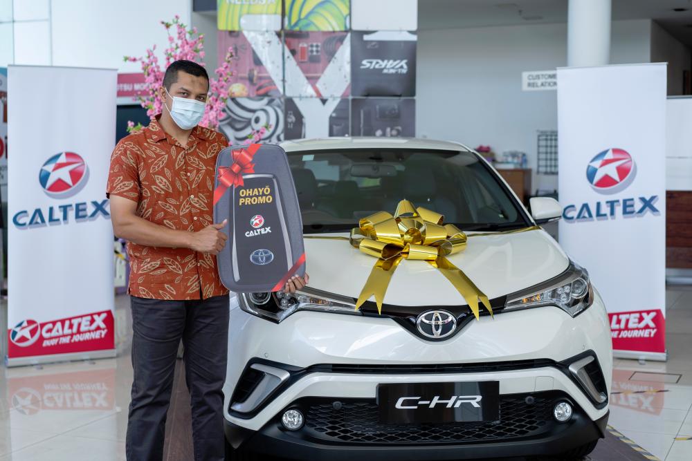 $!Khairul Fikrie Alias and the Toyota C-HR he won in the contest.