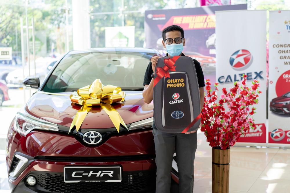 $!Mohd Yarid Ahmad and the Toyota C-HR he won in the contest.