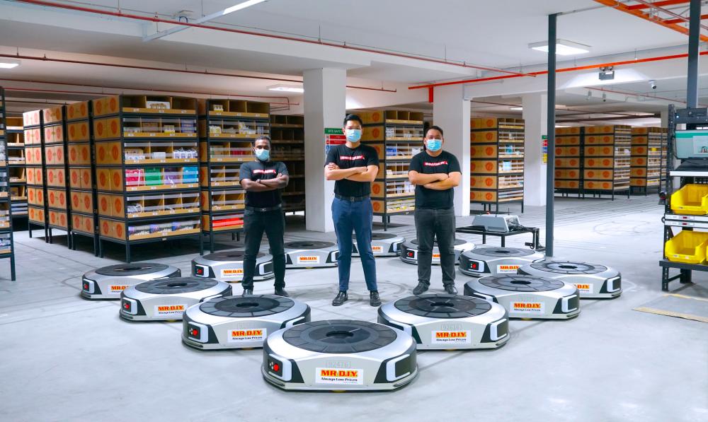 The warehouse is equipped with programmable robots that are able to fulfil online purchases faster.