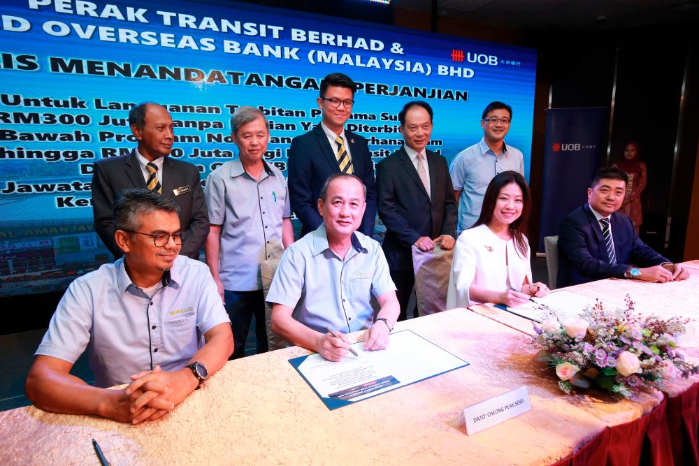 At the signing ceremony are (seated from left) Perak Transit director Datuk Wan Asmadi Wan Ahmad, executive director Datuk Cheong Peak Sooi, UOB Malaysia managing director &amp; country head of wholesale banking Ng Wei Wei and executive director &amp; country head of commercial banking II Beh Wee Khee. Looking on are (standing from left) Perak state executive financial officer Datuk Abu Bakar Said, Cheong, Perak state committee chairman for tourism, arts and culture Tan Kar Hing, Wong and Perak Transit director Ng Wai Luen.
