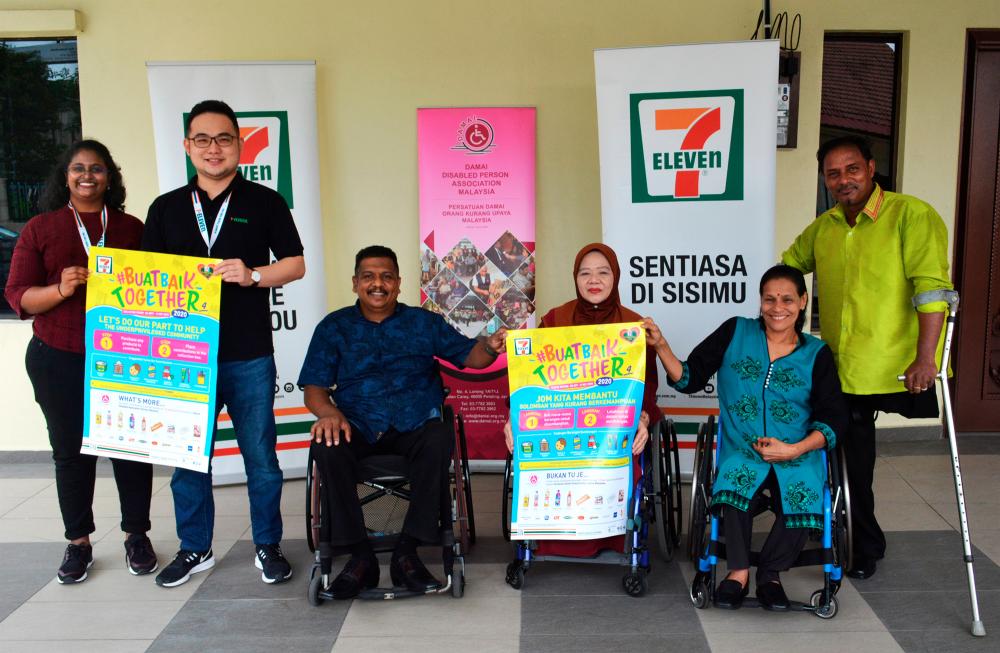Representatives of 7-Eleven Malaysia (first and second from left) posing with Damai Disabled Person Association Malaysia president V. Murugeswaran (third from left) alongside the committee members of the non-profit organisation.