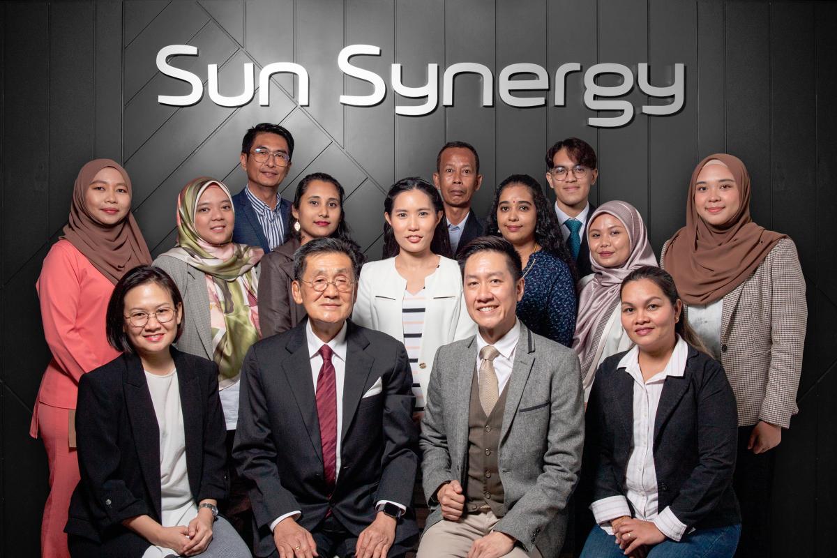 Michael Ng (seated, 2nd from left), Edwin Ng (seated, 3rd from left) and the Sun Synergy team.