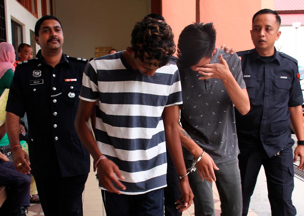 A 17-year-old boy with his friend, K. Guruprasanth, 19, were charged at the Taiping magistrate’s court today. - Bernama