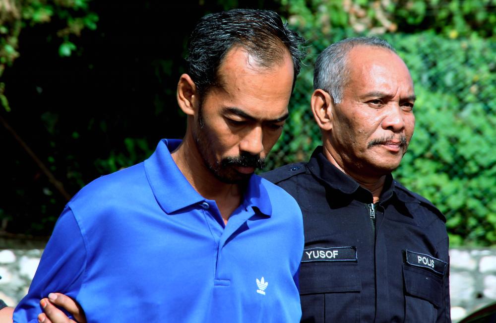 Plantation worker Abdul Rahman Abu Bakar, 43, was charged in the Parit magistrate’s court today for the charge of killing a disabled man in a quarry at Felcra Changkat Lada, Kampung Gajah, near here. - Bernama