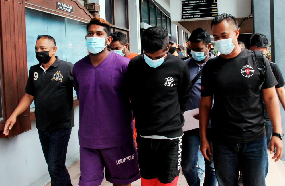 Three friends N. Avinesh Sarma, 22, S. Lingeshwarran, 24, dan P. Siva Raman, 33, were charged at the Majistrate’s Court on Jan 18 with murdering a man in a forest in Tanjung Rambutan.--fotoBERNAMA (2021) Copyrights Reserved